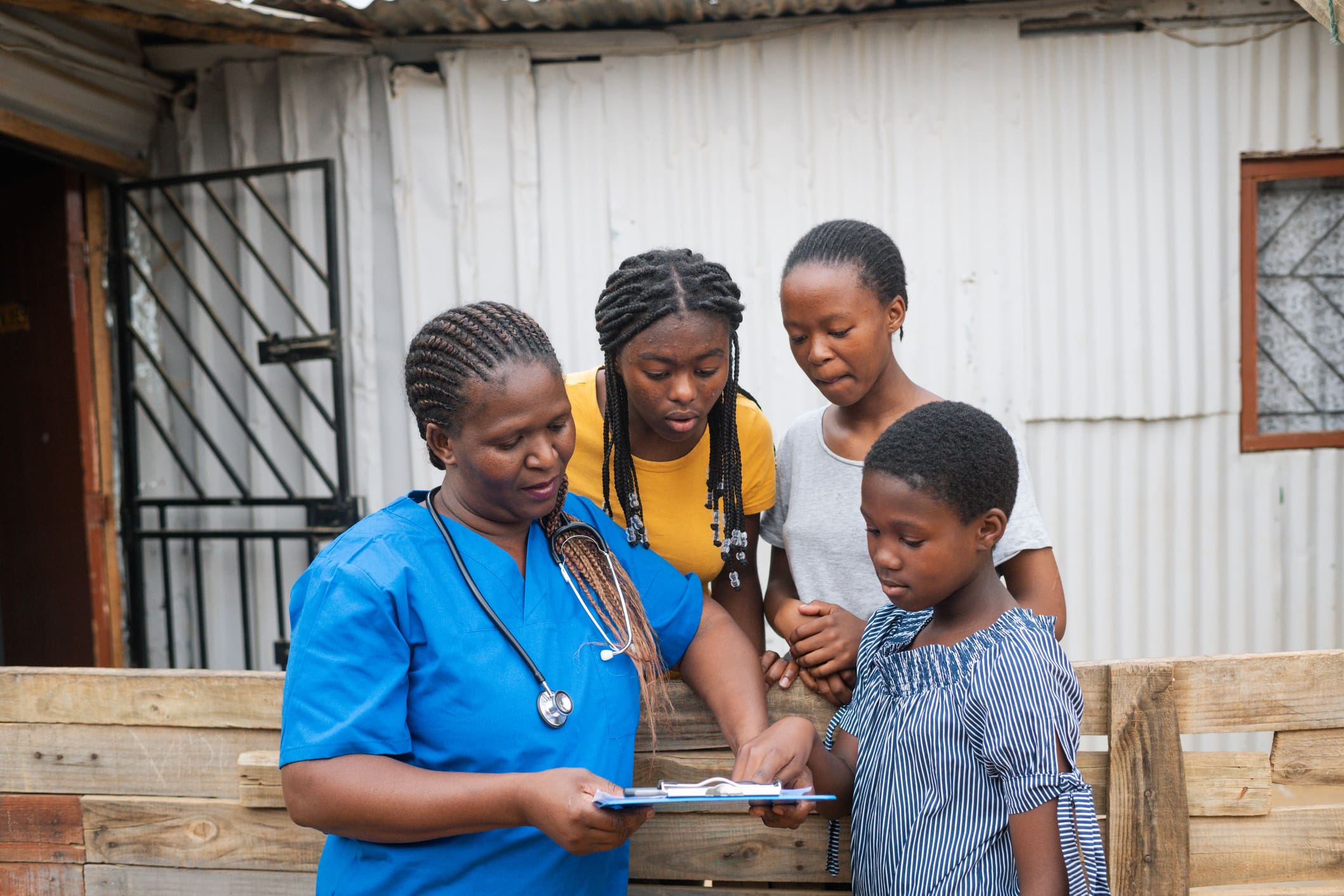 Nurse discussing with three family members