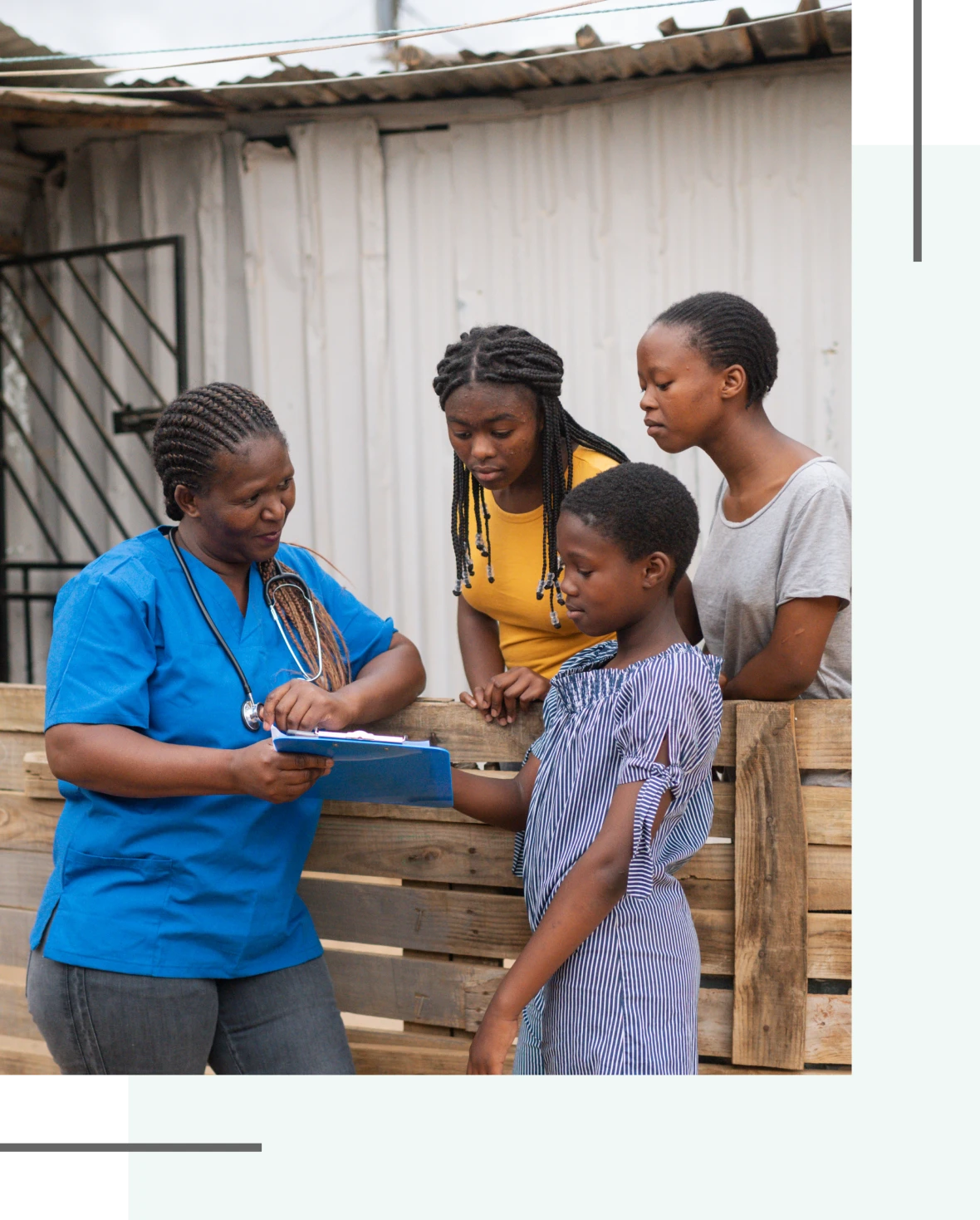 Healthcare worker speaking with family outdoors