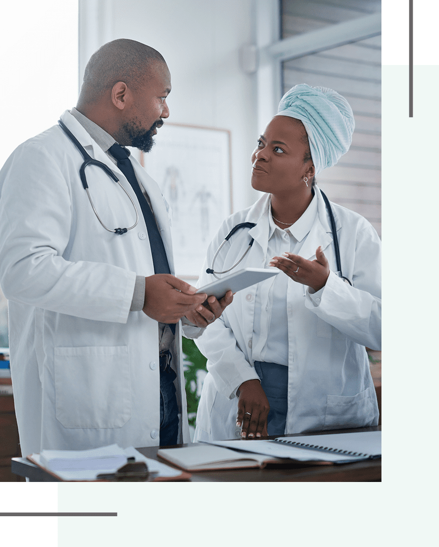 Doctors discussing patient information in clinic